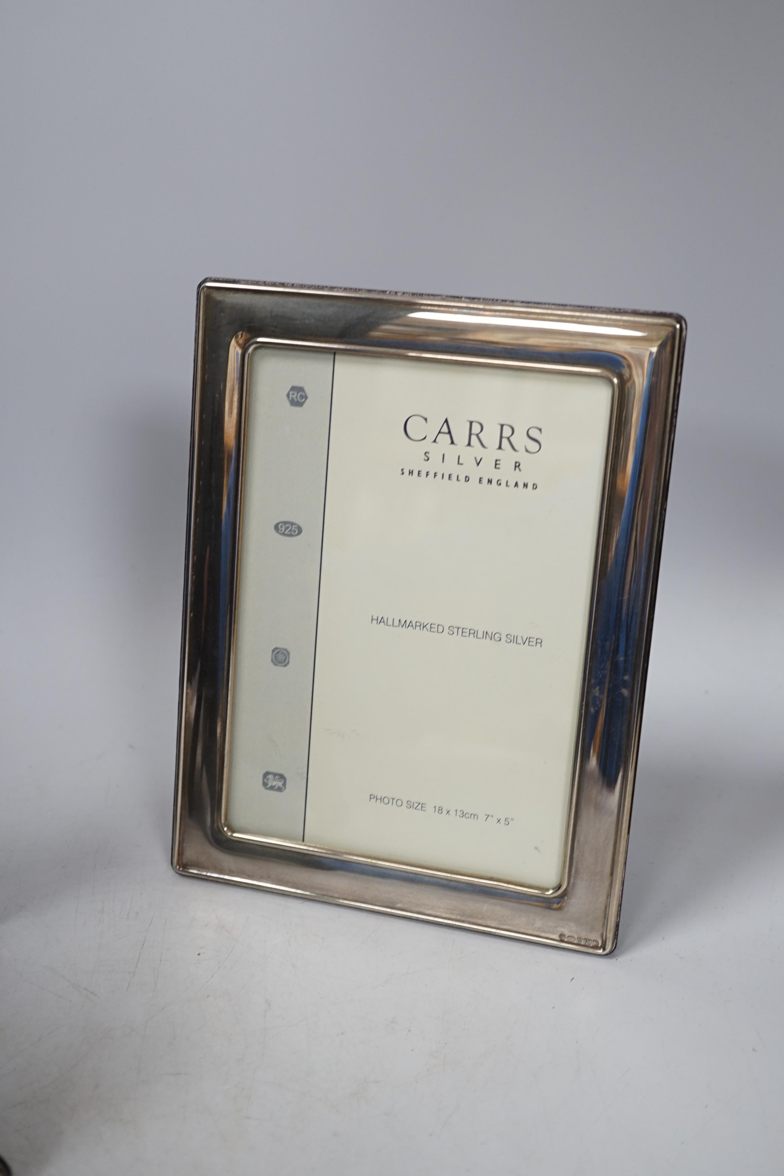 Two modern Carrs silver photograph frames, one of Art Nouveau design, 21cm, and a similar timepiece, 21cm